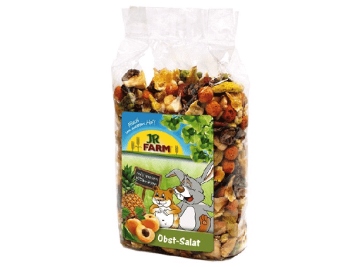 Skål med JR FARM Obst-Salat, en blanding af tørret frugt og grøntsager, velegnet til gnavere og mindre kæledyr. Ideel som sund snacks og kilde til vitaminer.