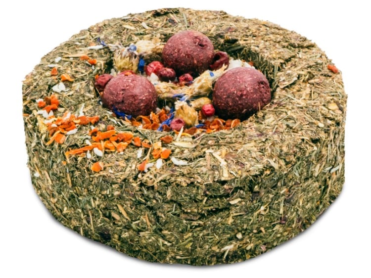 Naturlig snacks til gnavere, bestående af en rund kiks med frø, tørrede bær og nødder. Ideel til hamstere, mus og andre mindre kæledyr.