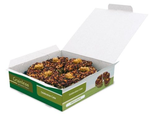 Fejring kage til gnavere fra Grainless, pakket i en åben æske, der viser flere portioner med farverige ingredienser, ideel til små kæledyr som hamstere og marsvin.